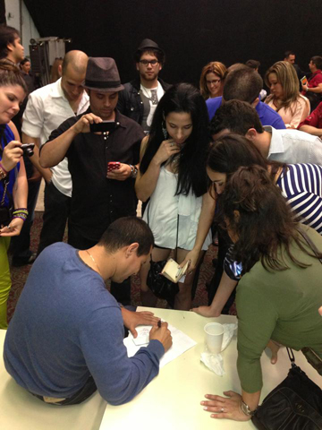 Israel gives autographs after Miami show